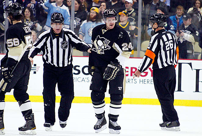 Matt Cooke (left) and his reputation loom over Erik Karlsson's ghastly, season-ending Achilles injury.